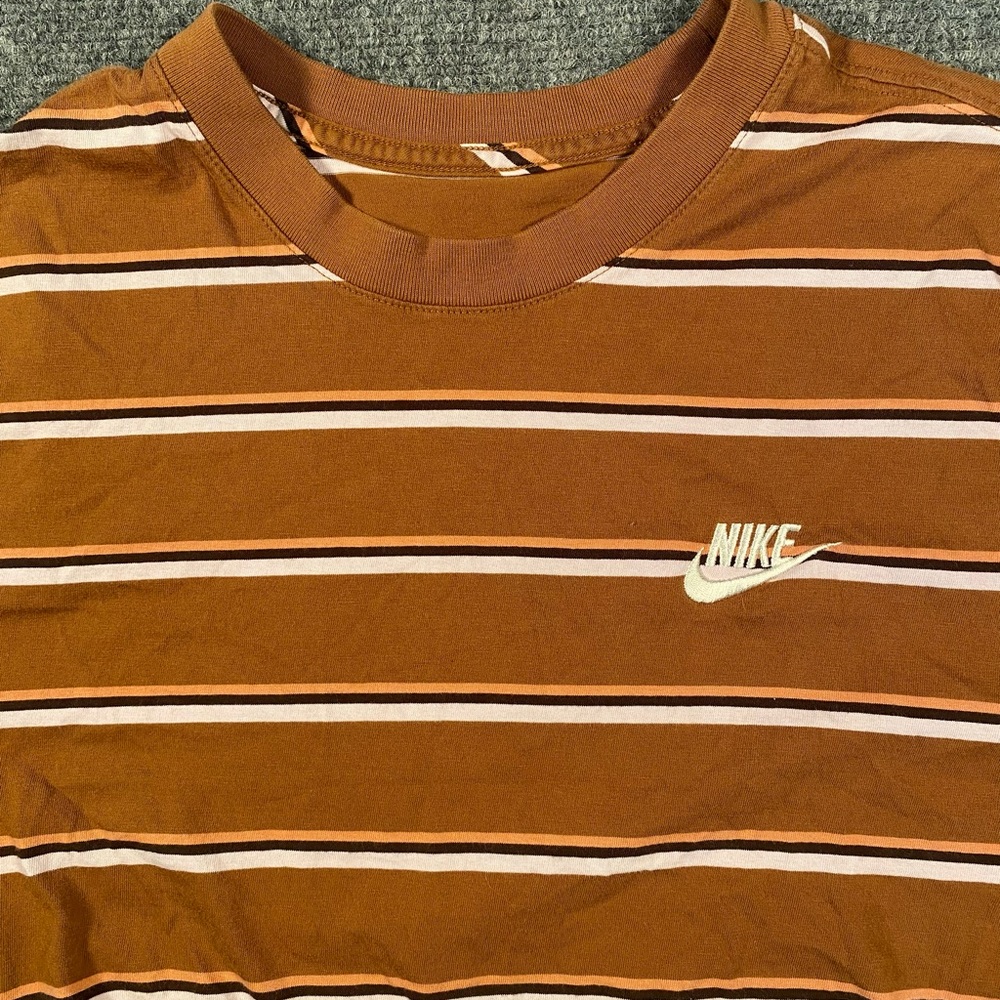 The Nike Tee men’s S cinnamon striped short sleeve skater tee
